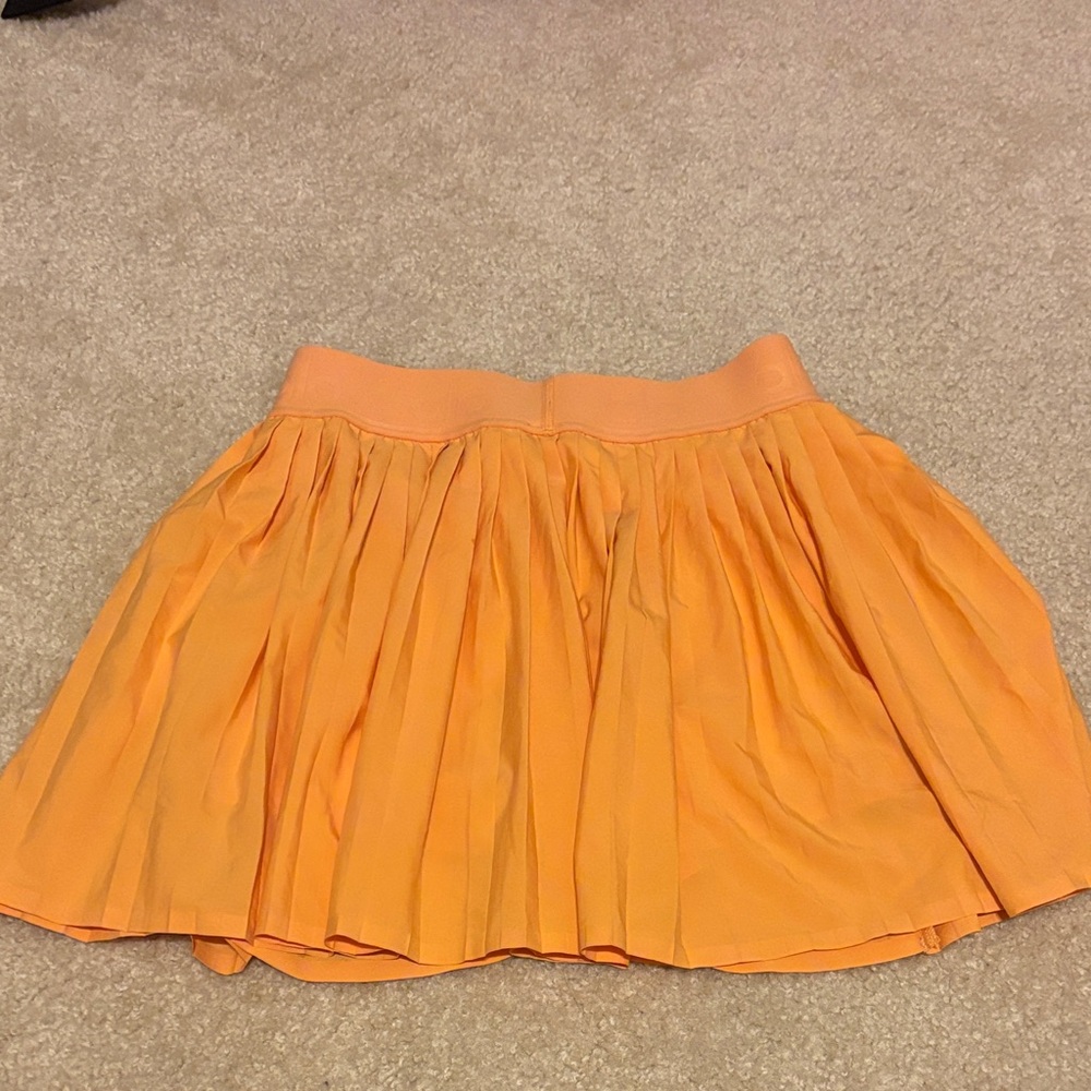 ALO Yoga Women's Aces Tennis Skirt in orange Canteloupe size XS - Picture 5 of 6
